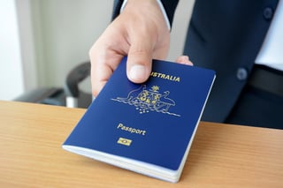 Hands Giving Passport Of Australia