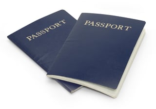 Two blue passports stacked together