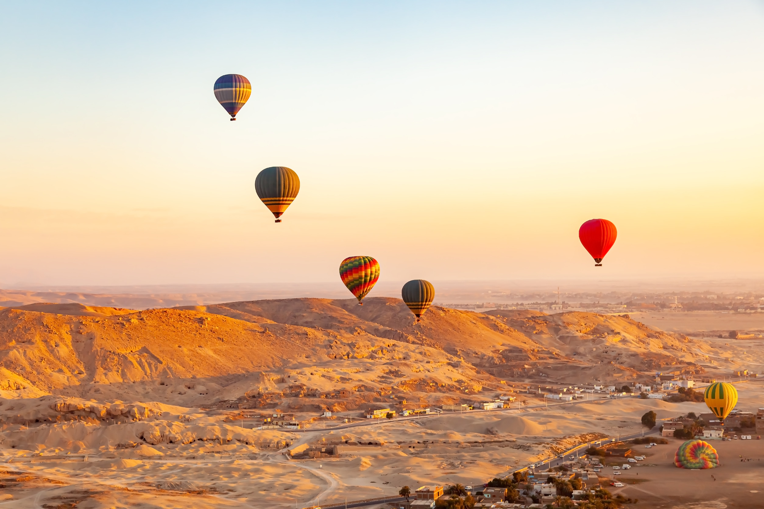 Hot air balloons flying over Valley of The Kings